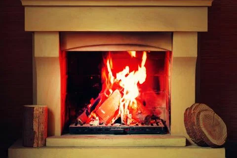 Burning Fireplace in winter time. Stock Photos