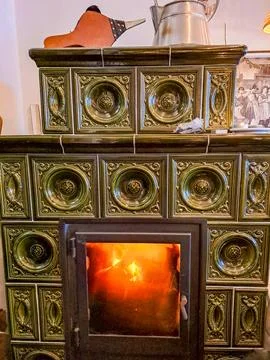 Burning firewood in fire-box of fireplace in country cottage.Rustic cooking oven Stock Photos
