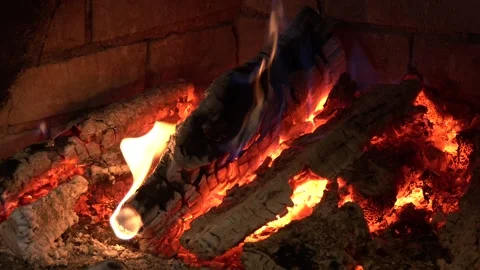 Burning firewood in the fireplace close up Video stock 128277304