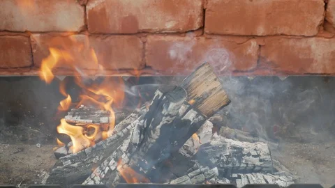 Burning firewood in the grill Stock Footage 129270852