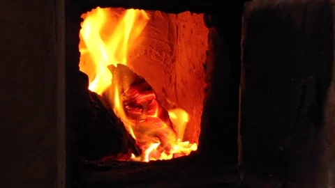 Burning firewood in old rustic brick stove with open door. Stock Footage 83035327