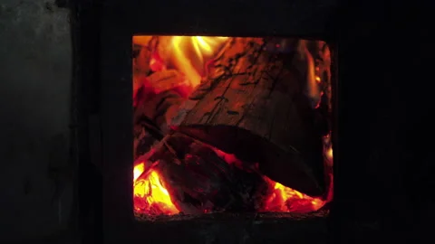 Burning firewood in the stove. Fire close up Stockbeeldmateriaal 154357828