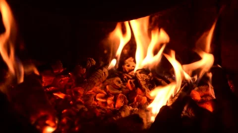 Burning Firewood with Warm Orange Flames in Dark Fireplace Stock Footage 340006199