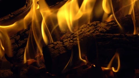 Burning firewoods with orange flame in slow motion, closeup view. Video stock 121343746