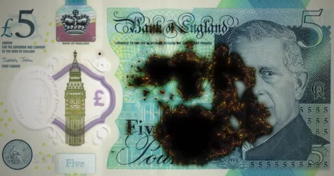 Burning five-pound note, 5 pound sterling banknote with smoldering and burning Stock Footage 332928098
