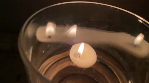 The burning flame of candles help to relax and calm the mind. Stock Footage 239343821