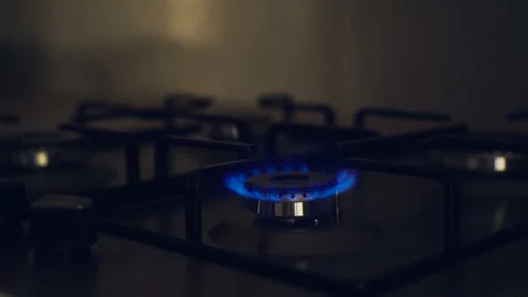 Burning flame of gas, blue fire on kitchen stove Stock Footage 210224905