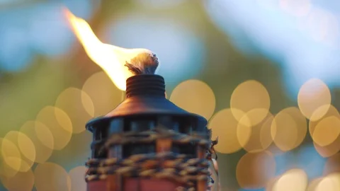 Burning flame lantern flickering in wind during sunset Stock Footage 118615972