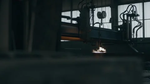 Burning Flame Under Machine in Dark Industrial Hall, Heavy Industry, Moody Shot Stock Footage 341529065