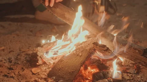 Burning flames flicker. Glowing embers and crackling flames light night. Warm Stock Footage 332518346