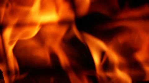 Burning flames. Macro through the metal grill. Stock Footage 130945685