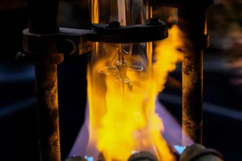 Burning flasks for molten glass lamps in the lamp factory Stock Photos