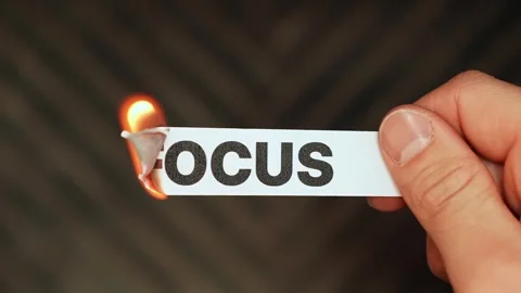 Burning “focus” label symbolizes distraction, procrastination, scattered Stock Footage 333654233