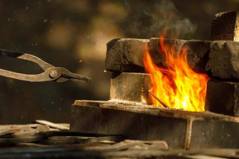 A burning forge made of bricks in nature Stock Photos