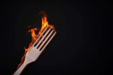 Burning fork on black background Stock Illustration