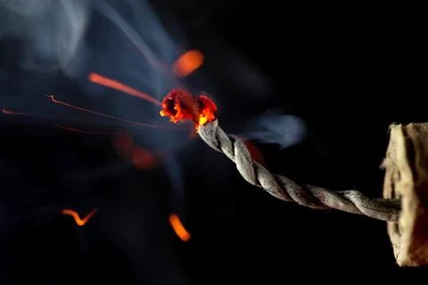 Burning fuse of a firecracker Stock Photos