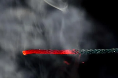 Burning fuse of a firecracker Stock Photos