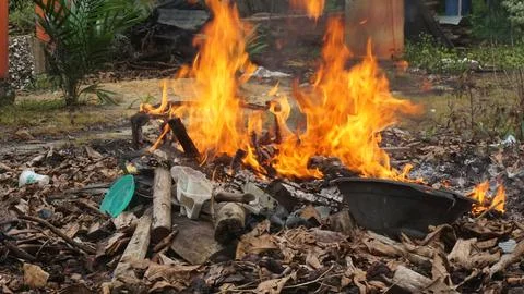 Burning Garbage in the Backyard Stock Photos