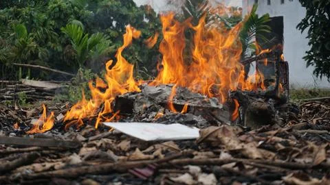 Burning Garbage in the Backyard Stock Photos