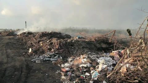 Burning garbage dump, ecological pollution. spontaneous garbage dump. Stock Footage 33037376
