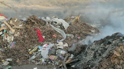 Burning garbage dump, ecological pollution. spontaneous garbage dump. Stock Footage 33037407