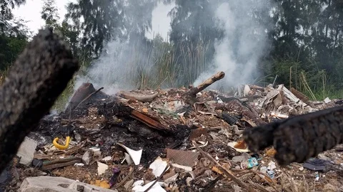 Burning garbage dump pollution in thailand 3 Stock Footage 92674324