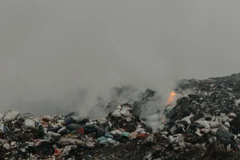 Burning garbage polluting the atmosphere Stock Photos