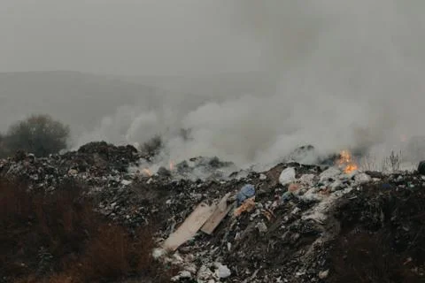 Burning garbage polluting the atmosphere Stock Photos
