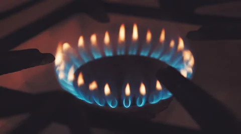 Burning gas in a kitchen stove. The camera moves around Stock Footage 61553858