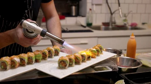 Burning glaze on a sushi roll Stock Footage 105608480