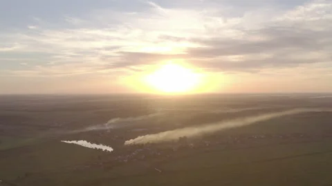 Burning grass in the field. the start of the fire. at sunset a field in smoke Stock-Footage 138362134