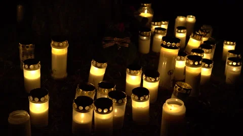 Burning grave candles commemorating all souls' day Stock Footage 289048167