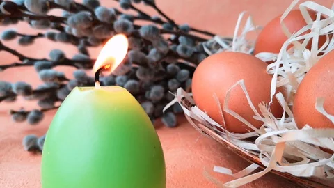 Burning green candle, eggs, willow branches Stock Footage 104849772