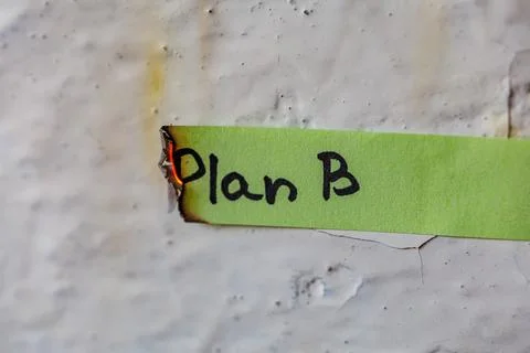 Burning green paper strip with handwritten text Plan B, backup plan failure and  Stock Photos