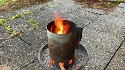 Burning grill chimney starter 1 Stock Footage 169247156