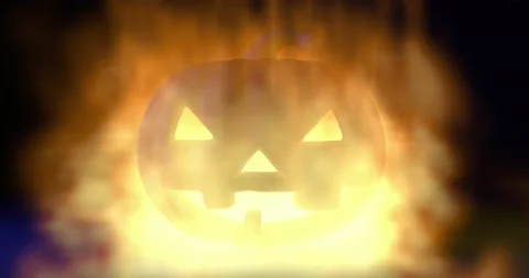 Burning Halloween spooky pumpkin in the fire. Stock Footage 143816392