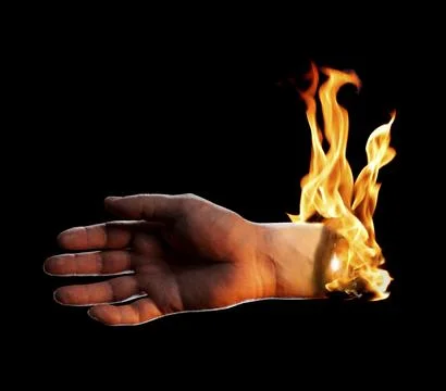 A Burning hand on black background Stock Photos