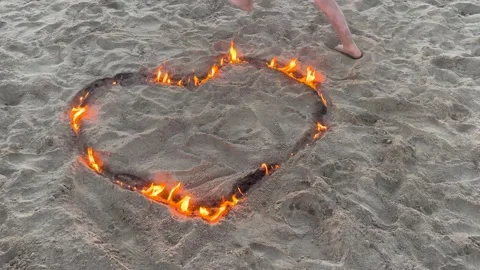 Burning heart on the beach Stock Footage 211820715