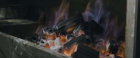 Burning Hexagonal Charcoal Under BBQ Grill Stock Footage 260933353