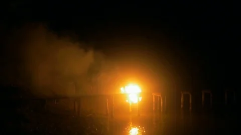 Burning hot fireplace in forest at dark night. 動画素材 82222572