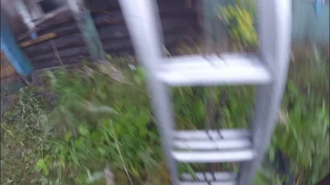 Burning the house. The fireman climbs the laddock to the roof of the building. Stock Footage 80451304