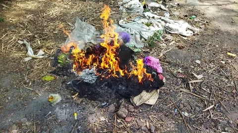 Burning household waste Stock Footage 166635249