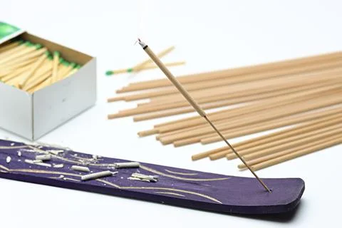 Burning Incense Aromatherapy with matches on white background Stock Photos