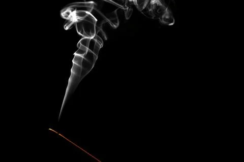 Burning incense on black background Stock Photos