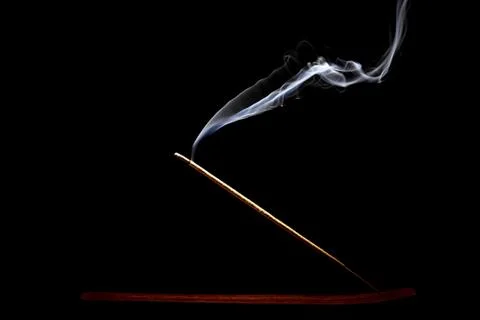 Burning incense on black background Stock Photos