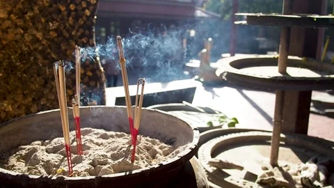 Burning incense in Buddhist temple Video stock 148430526