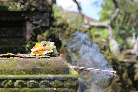 Burning incense in front of temple Stock Photos