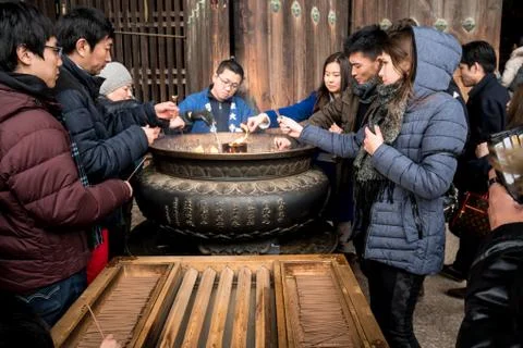 Burning incense for luck Stock Photos