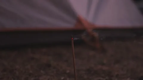 Burning incense outdoors Stock Footage 266654312