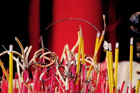 Burning incense on red background Stock Photos